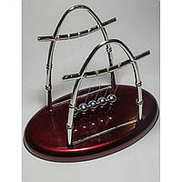 Маятник Ньютона на овальній підставці