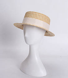 Жіноча солом'яний капелюх канотьє з вузькими полями.