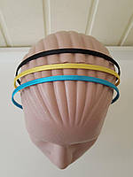 Обруч на голову, обтягнутий атласом. Кольори: червоний, жовтий , рожевий, блакитний.