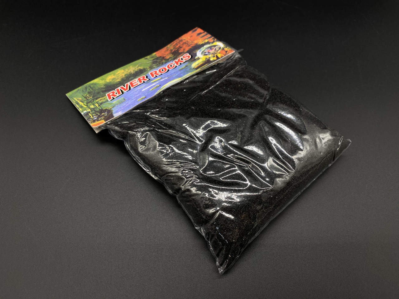Декоративний пісок чорного кольору, в індивідуальній упаковці вагою 0.5 кг, для творчості, акваріумів, ваз