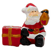 Декоративний новорічний свічник Дід Мороз з подарунком зі свічкою, 9х4х6,5 см, червоний з білим, кераміка (441686)