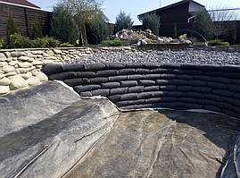 Изготовление зоны регенерации Экопруда с применением мешков из геотекстиля.