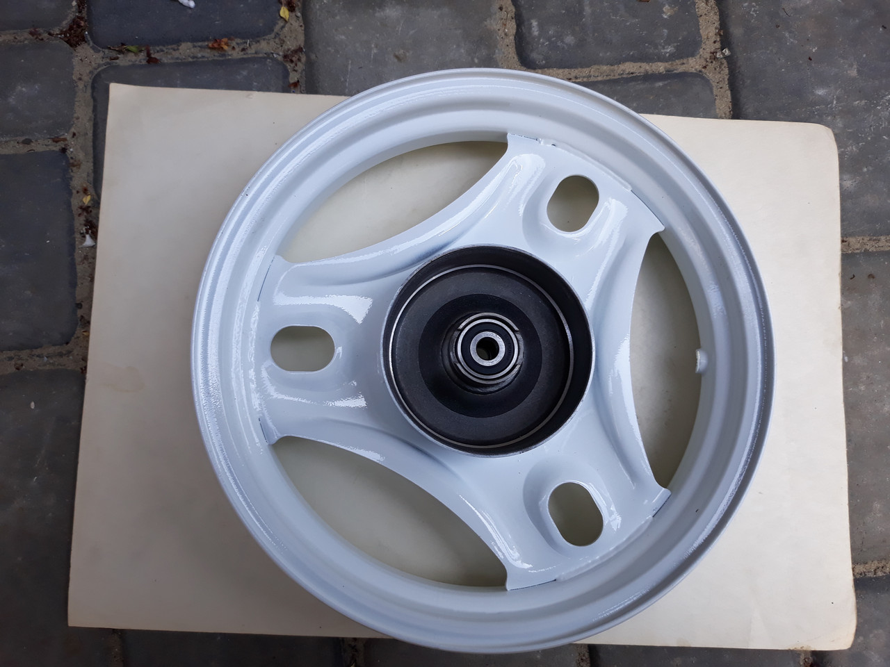 Диск колеса 10х2.5 передній залізний з підшипниками, шальником і втулкою на скутер Honda Dio AF 34,35, фото 1