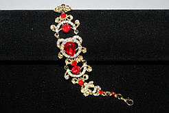 Стильний весільний браслет золотистий із червоним камінням