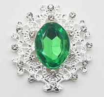 Камінь в сріблястій ажурній оправі 24*26 мм зелений смарагдовий