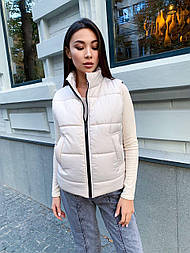 Жіночий плащевый стьобаний жилет на силіконі з кишенями на блискавці 651448