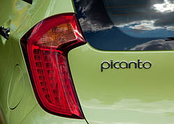 Емблема напис багажника Kia Picanto 86320-07000