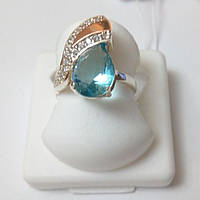 Кольцо из серебра и золота с голубым камнем Гала
