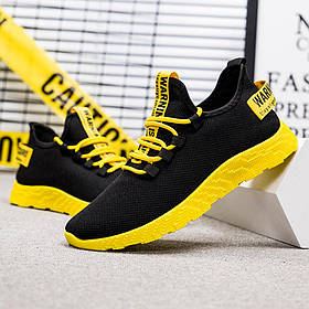 Зручні чоловічі кросівки з жовтою піксельною підошвою