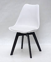 Белый стул с пластиковой спинкой и сиденьем эко-кожа Milan на черных деревянных ножках