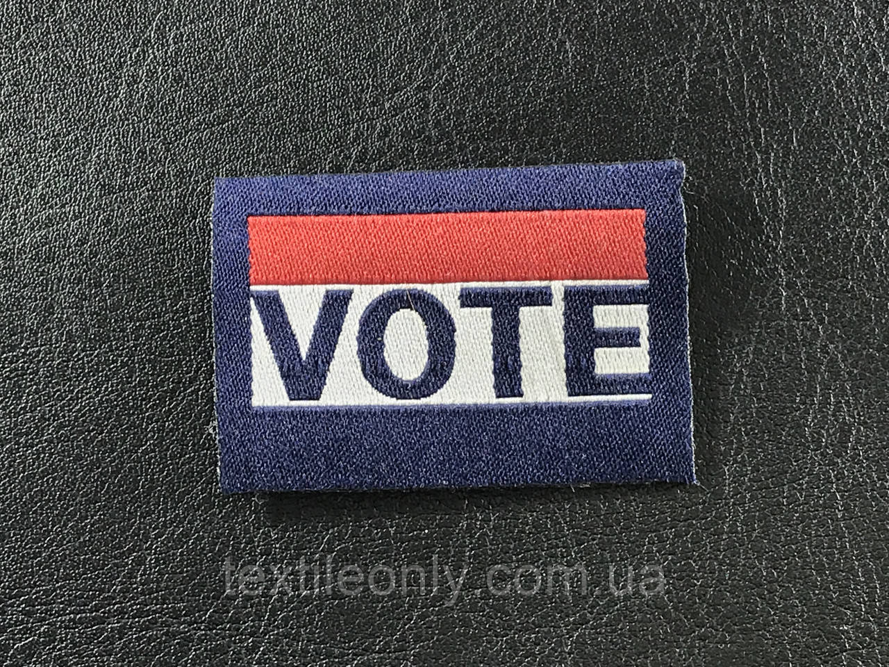 Етикетка VOTE жакард 45х30 мм