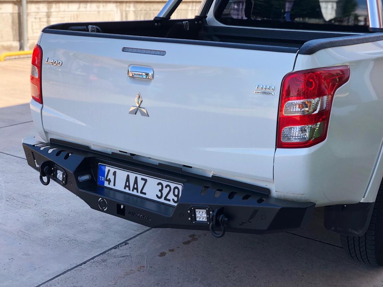 Бампера mitsubishi l200. Mitsubishi l200 силовой задний бампер. Задний бампер Mitsubishi l200 2020. Задний бампер Мицубиси л200 2019. Задний бампер л200 заводской.