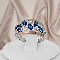 Красивое женское кольцо из серебра 925 пробы и золотыми пластинами 375 пробы и синими фианитами