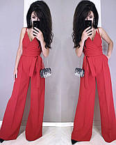 Стильний комбінезон зі штанами кльош верх на бретельці з декольте, фото 5