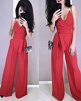 Стильний комбінезон зі штанами кльош верх на бретельці з декольте, фото 2