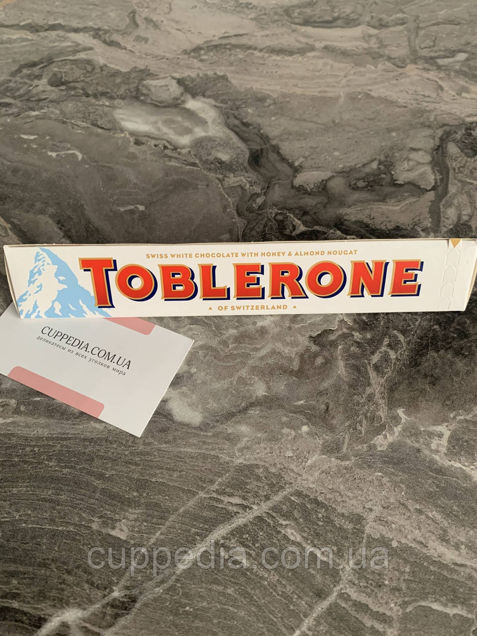 Білий шоколад Toblerone з медом і мигдальною нугою 100 грм