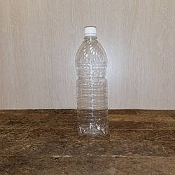 Фігурна прозора пляшка ПЕТ 1 літр із вузьким горлом у пакованні 150 штук.
