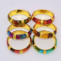 Браслети 6 шт пластикові золотисті з кольоровими вставками