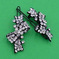 Шпилька на щелепу 2 шт. метал бантик із білими стразами