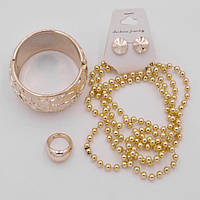 Комплект золотистий пластик браслет намиста кільце сережки