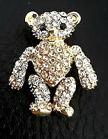 Брошка. Позолота. Камені: білий та коричневий циркон. Діаметр: 2.5 см.