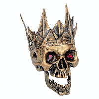 Череп с подвижной челюстью и короной на Хэллоуин.