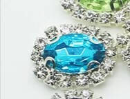 Камінь в сріблястій оправі 2*1,5 см блакитний