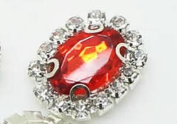 Камінь в сріблястій оправі 2*1,5 см червоний