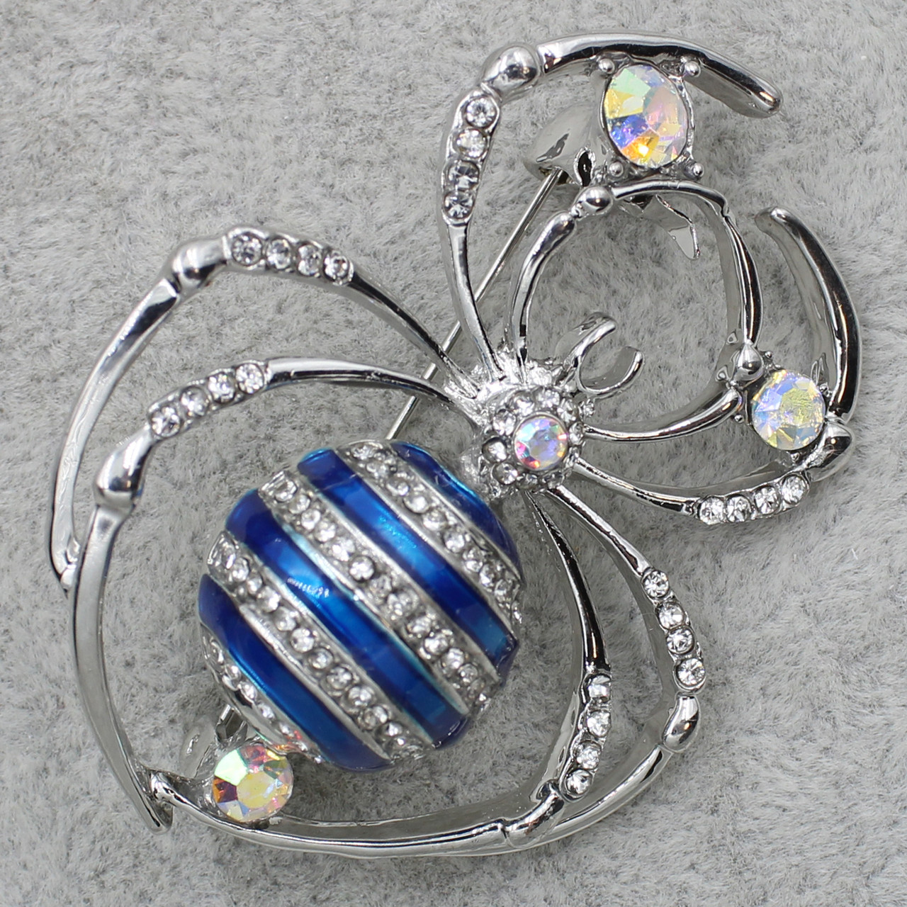 Брошка-павук сріблястого кольору блакитна емаль із мінливими каменями розмір виробу 60х40 мм