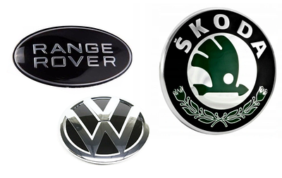 Емблеми на капот і грати радіатора