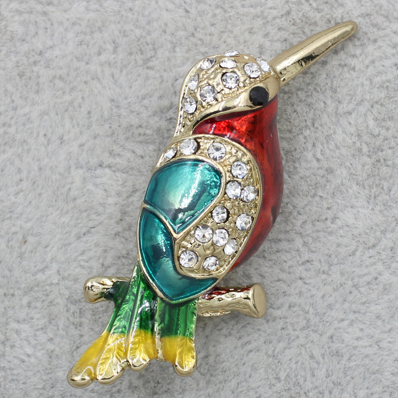 Брошка Колібрі металева золотиста покрита різнобарвною емаллю зі стразами розмір виробу 3 х 5 см
