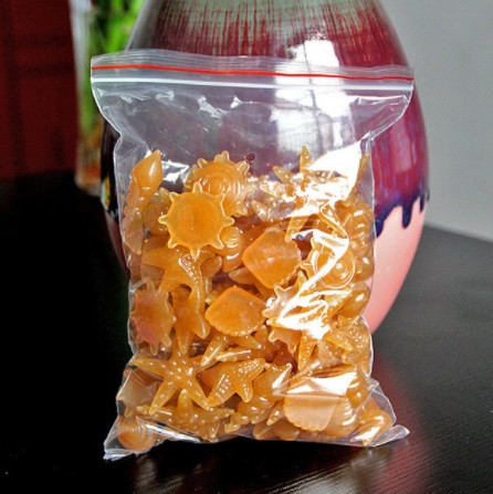 Набір люмінесцентних каменів помаранчеві, світяться жовтим - 10 штук в наборі (розмір одного каменю 1,5-2,5 см), фото 1