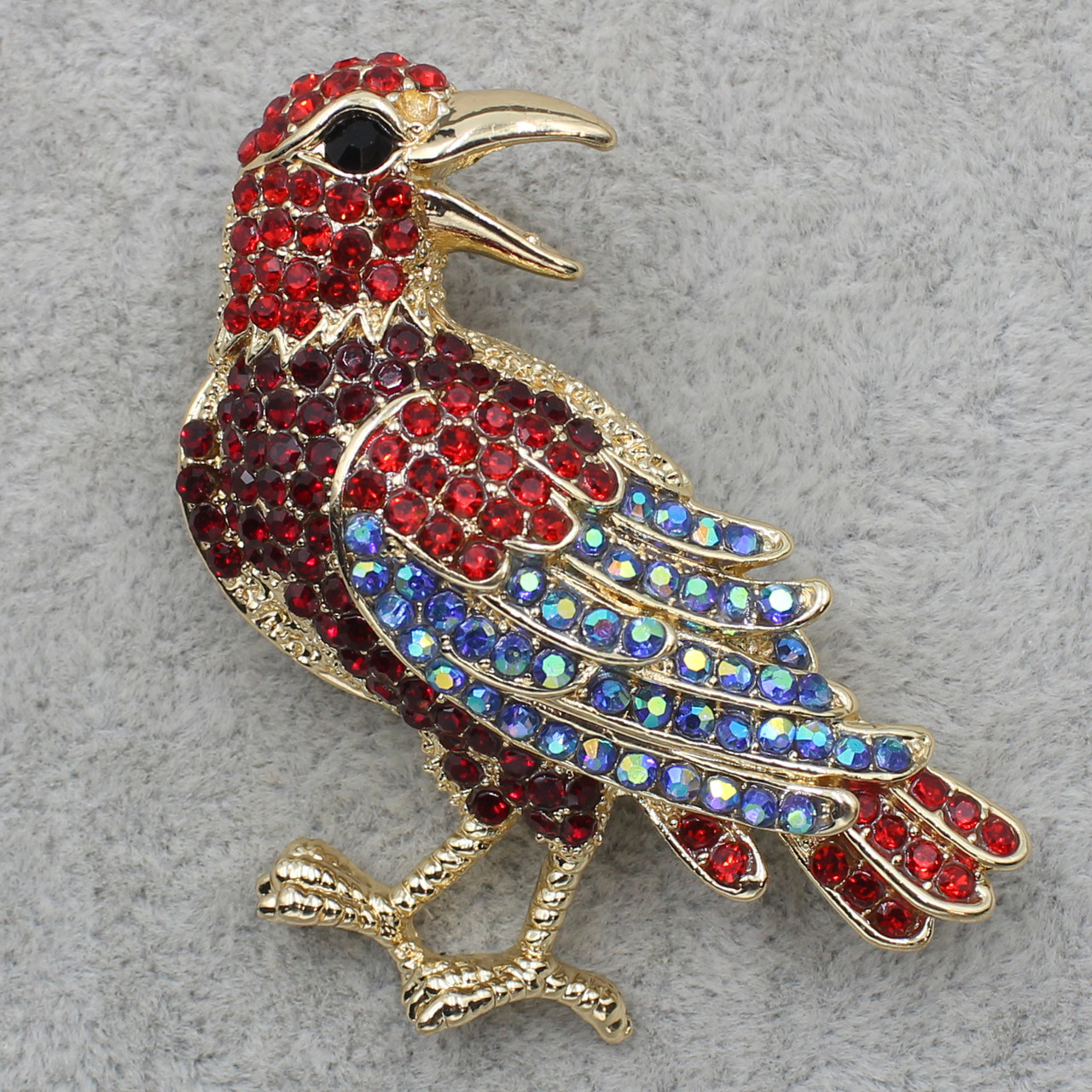Брошка металева золотиста Пташка з різнобарвними кристалами розмір виробу 50х50 мм