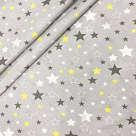 Польська бязь "Зоряний карнавал жовто-сірий на сірому"