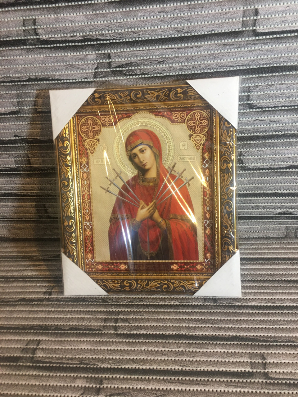 Ікона в рамці (оклад) "Богородиця Семистрельная".Розмір 43 на 33 див.