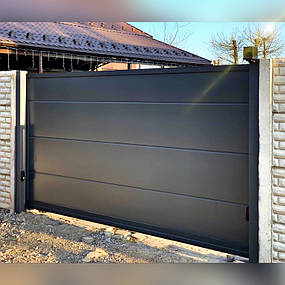 Изготовлены и установлены откатные ворота из сэндвич-панелей со стальной рамой, по такому же принципу изготовлена калитка с электромеханическим замком