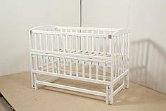 Детская кроватка Гойдалка VALERI с откидной боковиной на шарнирах бук белая