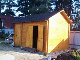 Дерев'яний госпблок з дровником з профільованого бруса