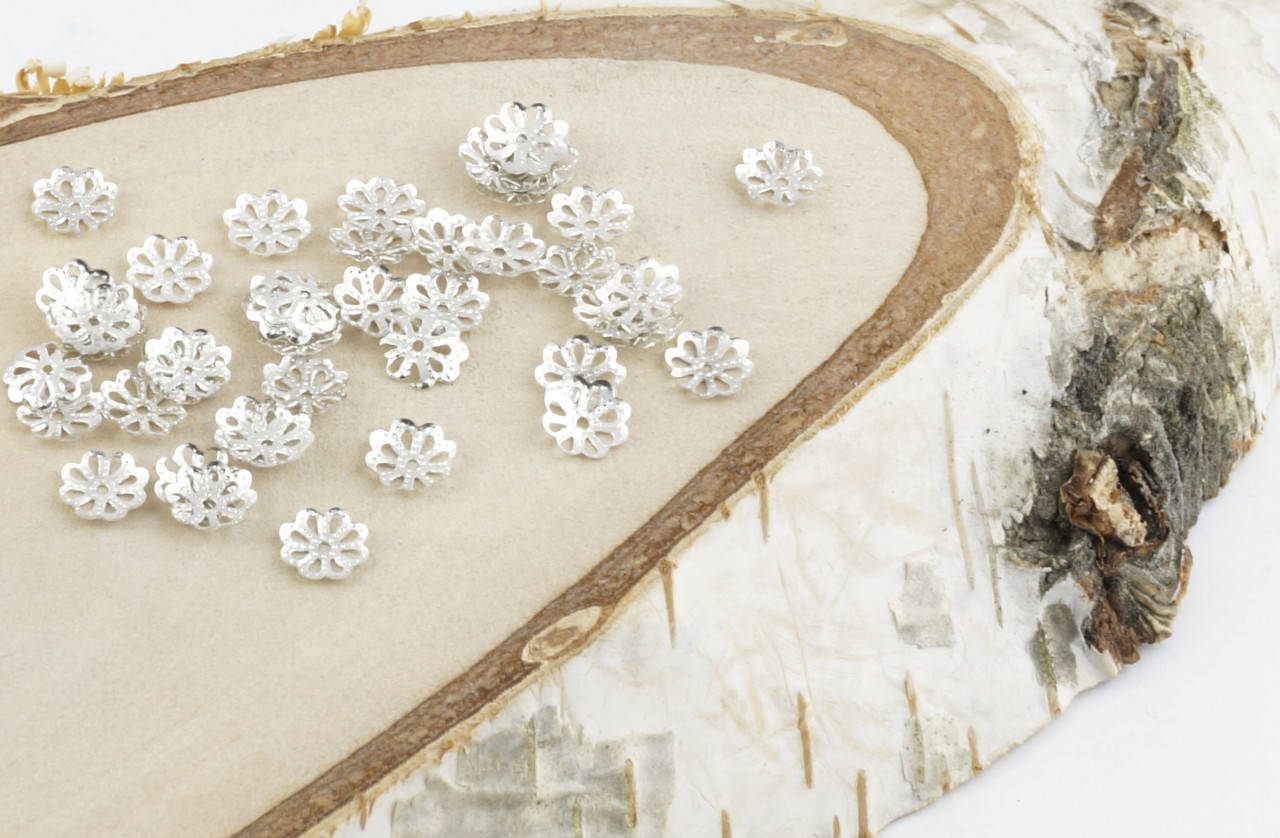 

Обниматель под серебро Цветочек 7 мм 5 грамм прибл. 200 шт