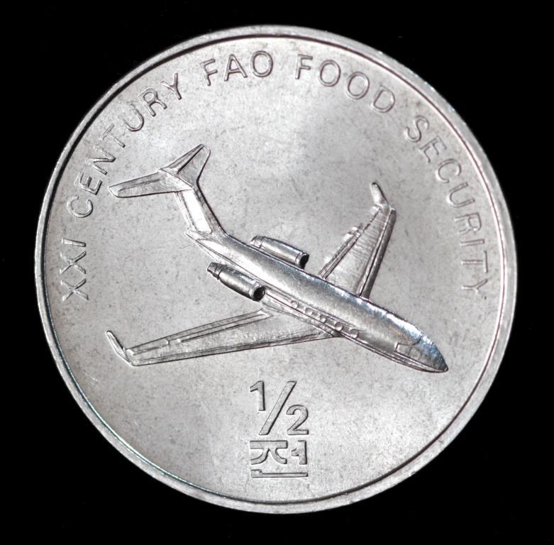 Монета Північної Кореї 1/2 чона 2002 р. ФАО. Самолет, фото 1