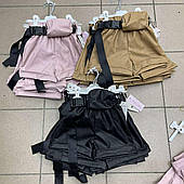 Дитячі шорти зі шкірозамінника із сумочкою для дівчаток оптом