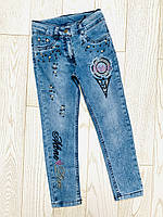 Голубі джинси на дівчинку 10-11років.