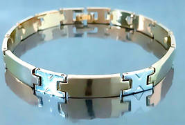 Браслет Аthena зі сталі. Позолота з лимонним відтінком + родій. Довжина: 21.5 см. Ширина: 8 мм.