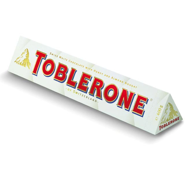 Швейцарський білий шоколад Toblerone з родзинками, нугою з меду і мигдальним горіхом, 100 г