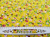 Тканина штапель темно-жовтого кольору з квітковим принтом