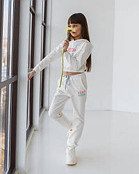 Дитячий спортивний костюм для дівчинки молочний оптом KEEP GOING