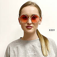 Стильні сонцезахисні окуляри з червоними лінзами