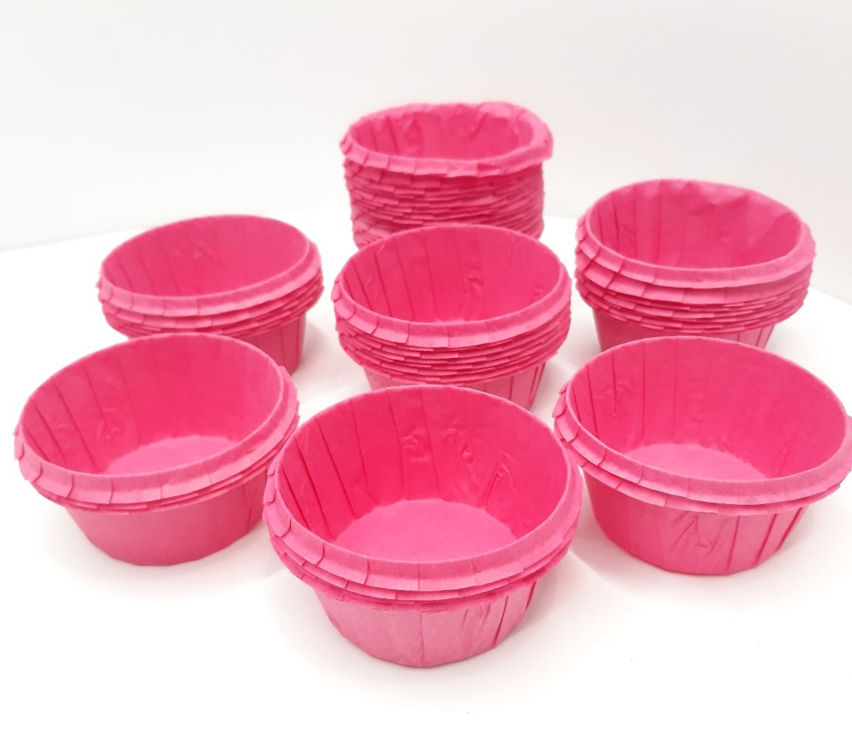 Паперова одноразова форма-капсула для кексів рожевого кольору з посиленим бортом 55х35