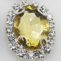 Камінь в сріблястій оправі 2*1,5 см світло-жовтий