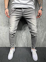 Серые джинсы мужские зауженные однотонные классические с имитацией потёртостей демисезонные